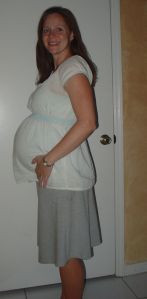 Pregnant for the 2nd time, wearing a borrowed skirt and a gifted shirt.